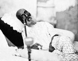 Mirza Abu Zafar Sirajuddin Muhammad Bahadur Shah Zafar (Urdu: ابو ظفر سِراجُ الْدین محمد بُہادر شاہ ظفر‎), better known as Bahadur Shah Zafar (Urdu: بہادر شاہ دوم‎), on 24 October 1775 – died 7 November 1862), was the last Mughal emperor and a member of the Timurid Dynasty.<br/><br/>

Zafar was the son of Mirza Akbar Shah II and Lalbai, who was a Hindu Rajput, and became Mughal Emperor when his father died on 28 September 1837. He used Zafar, a part of his name, meaning 'victory', for his nom de plume as an Urdu poet, and he wrote many Urdu ghazals under it.<br/><br/>

After his involvement in the Indian Rebellion of 1857, the British tried and then exiled him from Delhi and sent him to Rangoon (now Yangon) in British-controlled Burma (Myanmar).